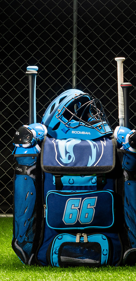 A blue bat bag filled with batting equipment