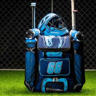 A blue bat bag filled with baseball gear