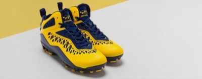 pair of yellow football cleats