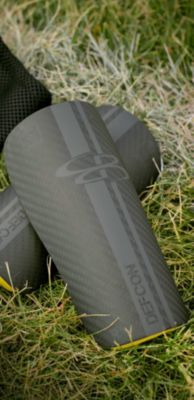  Carbon Fiber Shin Guard laying on soccer field