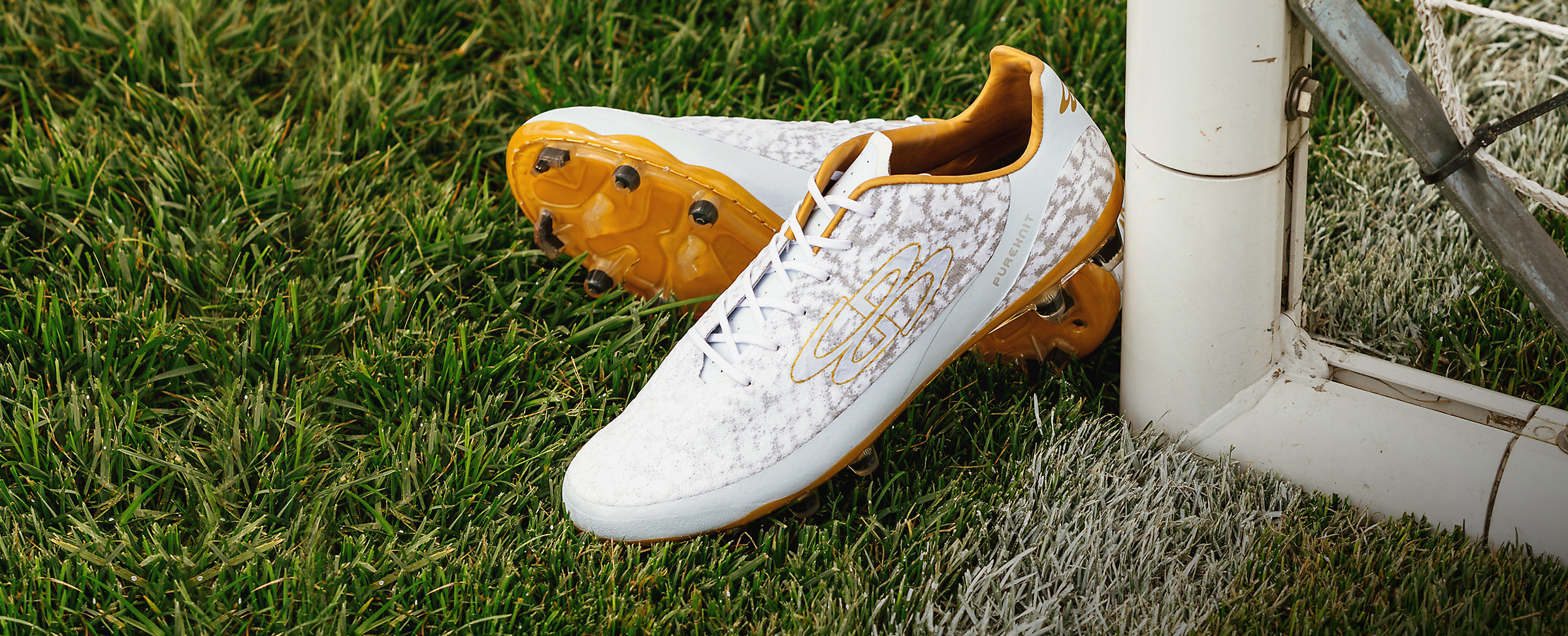 pair of yellow soccer cleats